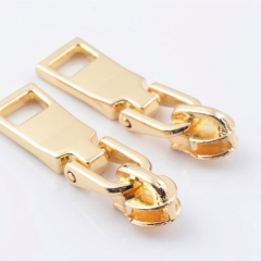Metal zipper head No. 5 glue tooth pull head shallow gold glue tooth head pull piece a large number of spot manufacturers wholesale